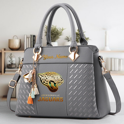 LIMITED EDITION - NEW CUSTOMIZED NFL30 JSJ JACKSONVILLE JAGUARS LUXURY HANDBAG IN MULTIPLE COLORS